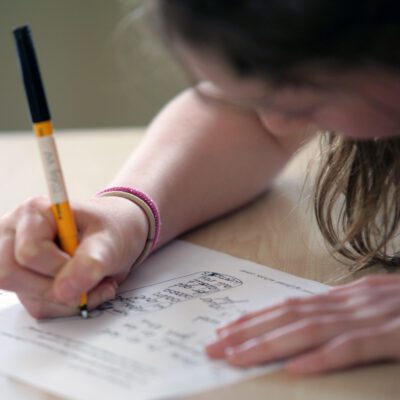 Pupil concentrating on writing