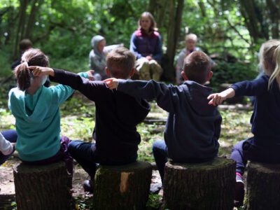 Children pointing during outdoor lesson