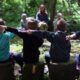 Children pointing during outdoor lesson