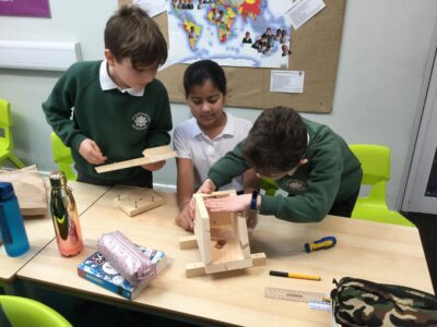 Children building a dormouse nesting box